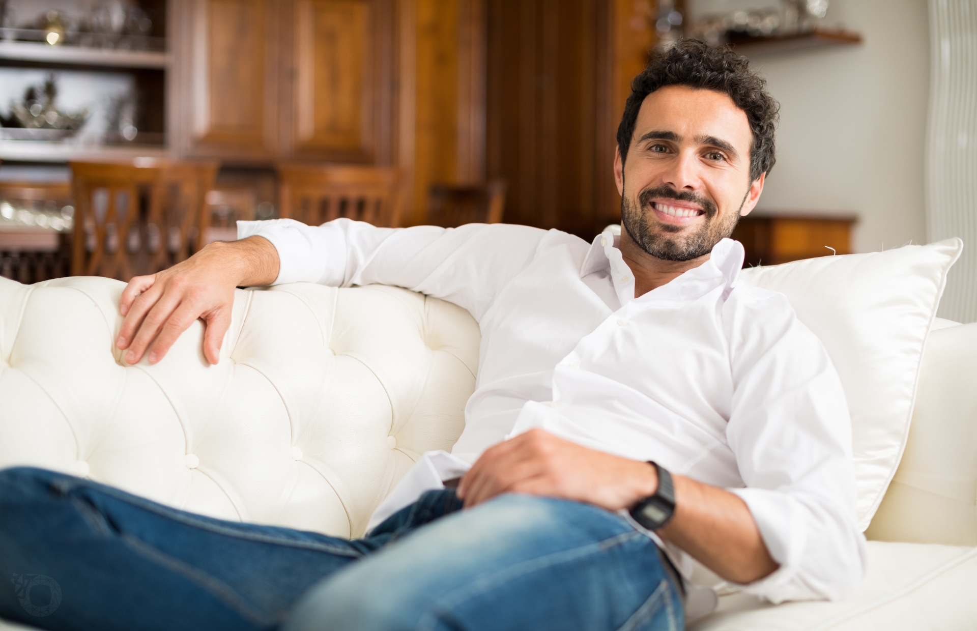 man relaxing on sofa at drug rehab facility in Louisiana