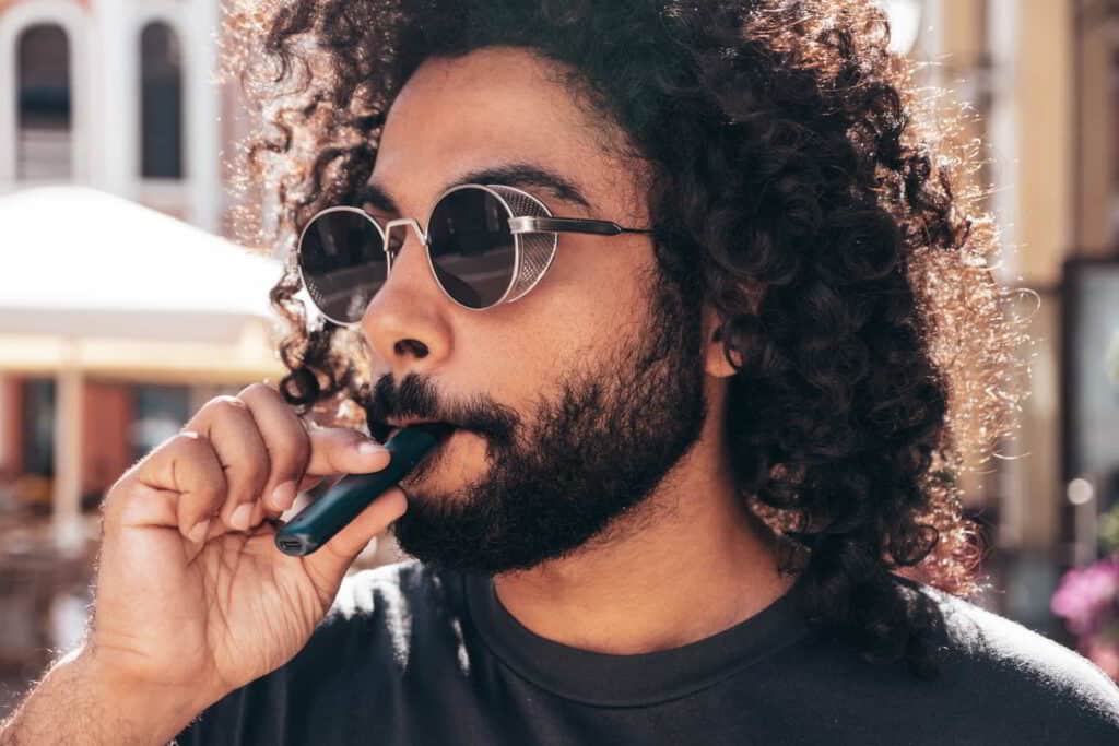 man enjoying a nad vitamin vape pen
